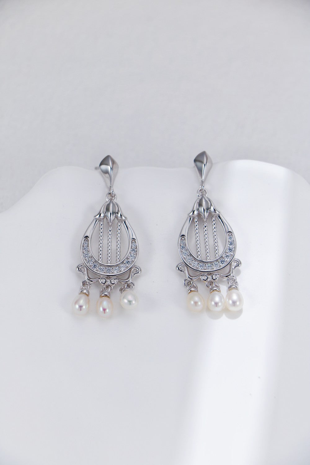 Harp-shaped silver earrings