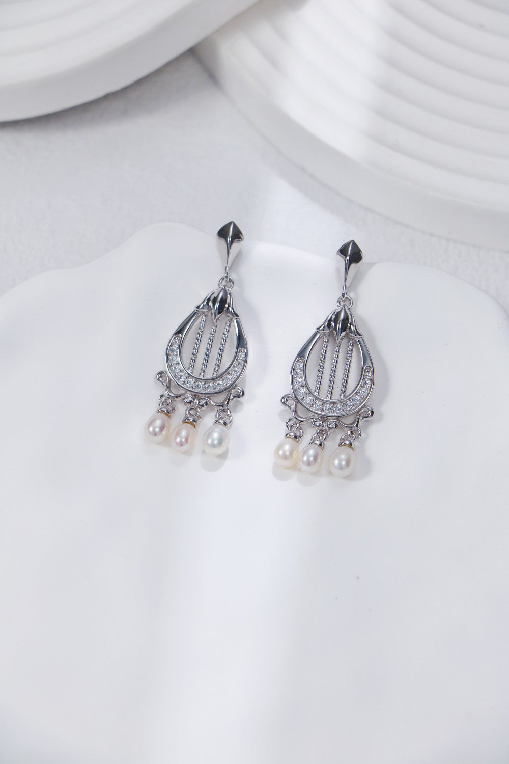 Harp-shaped silver earrings